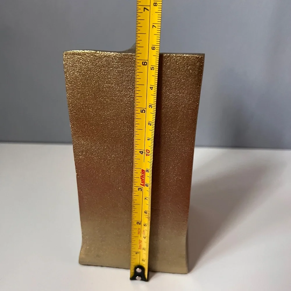 West Elm sculptural bookend in textured antique gold finish.